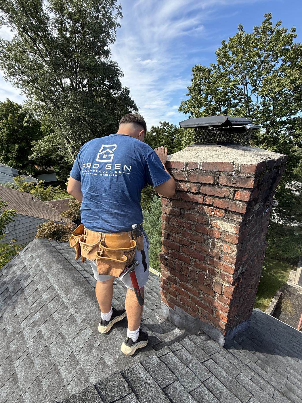 Pro Gen roofer inspecting a chimney